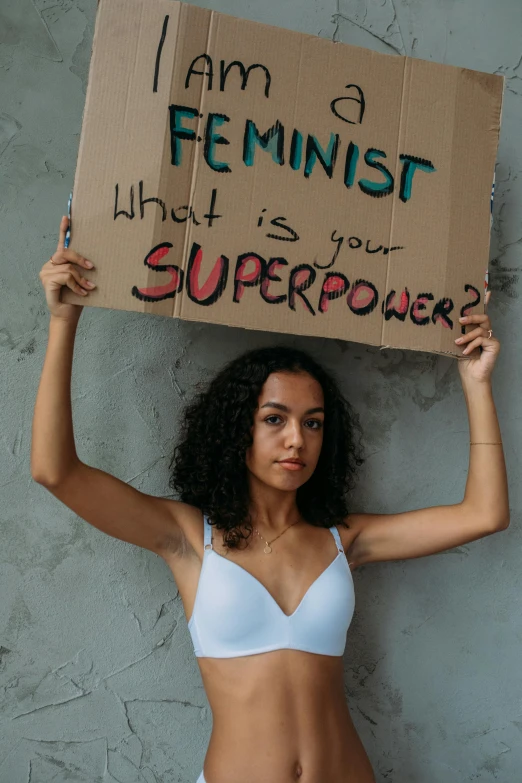 an image of a girl holding up a box