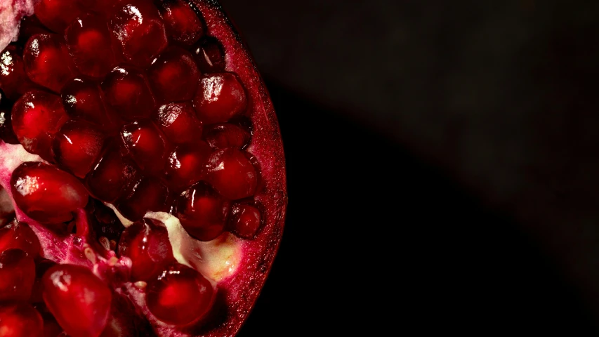pomegranates are shown on the surface, closeup