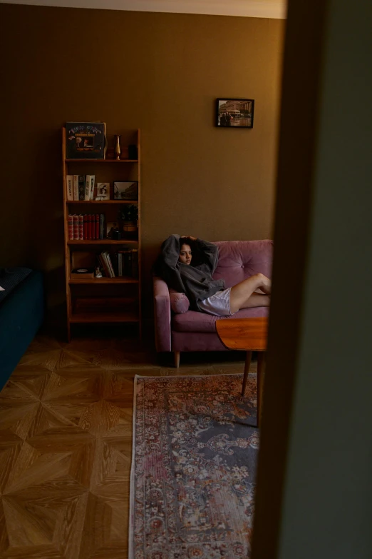 person sitting in the middle of a living room