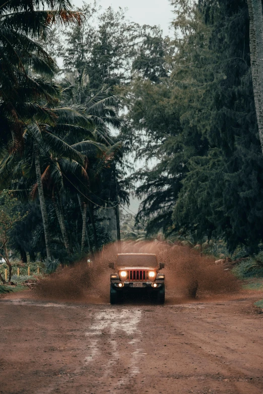 a car driving down the dirt road