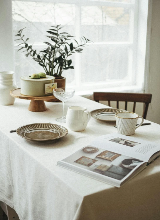 a close up of a table with a plate and a cup on it