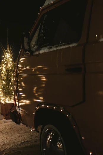 a truck decorated with a christmas tree in the dark
