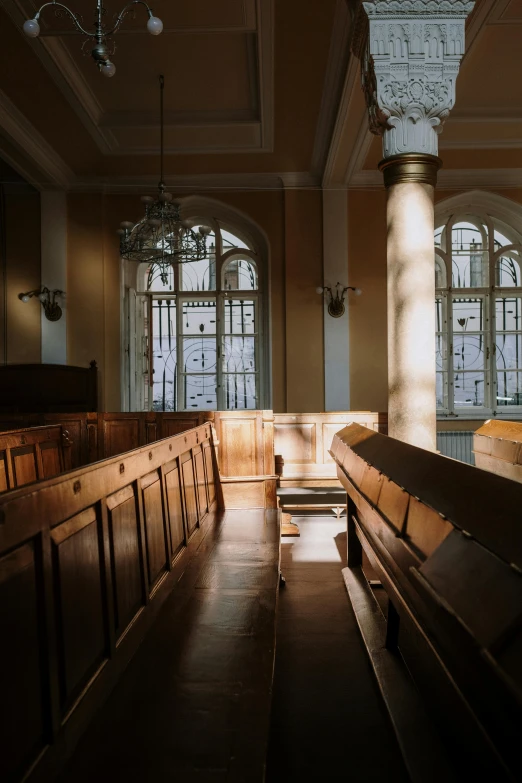 a wooden bench inside a dimly lit building