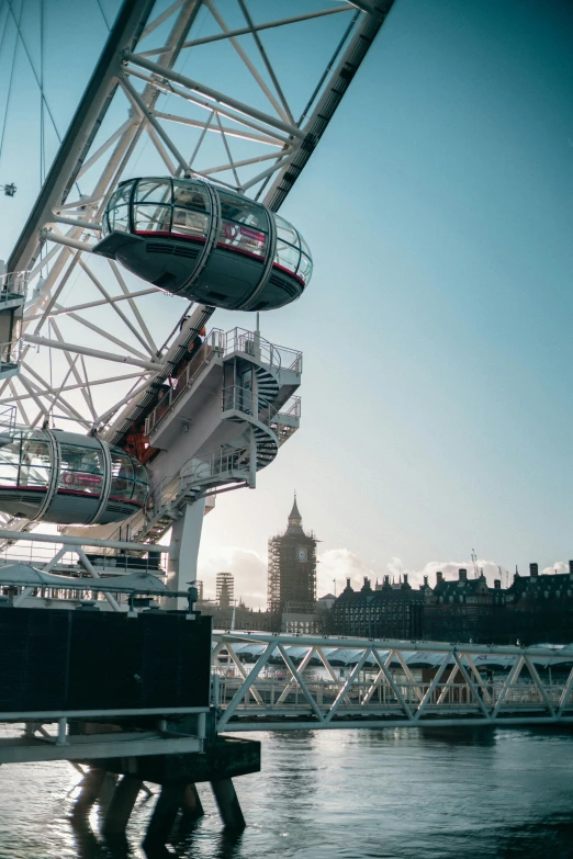 an unusual bridge has a train on it's sides