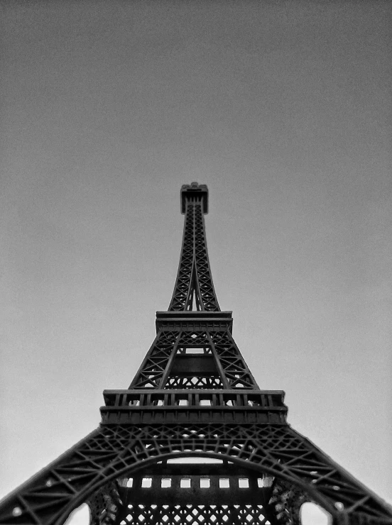 a tall metal tower with a clock at the top