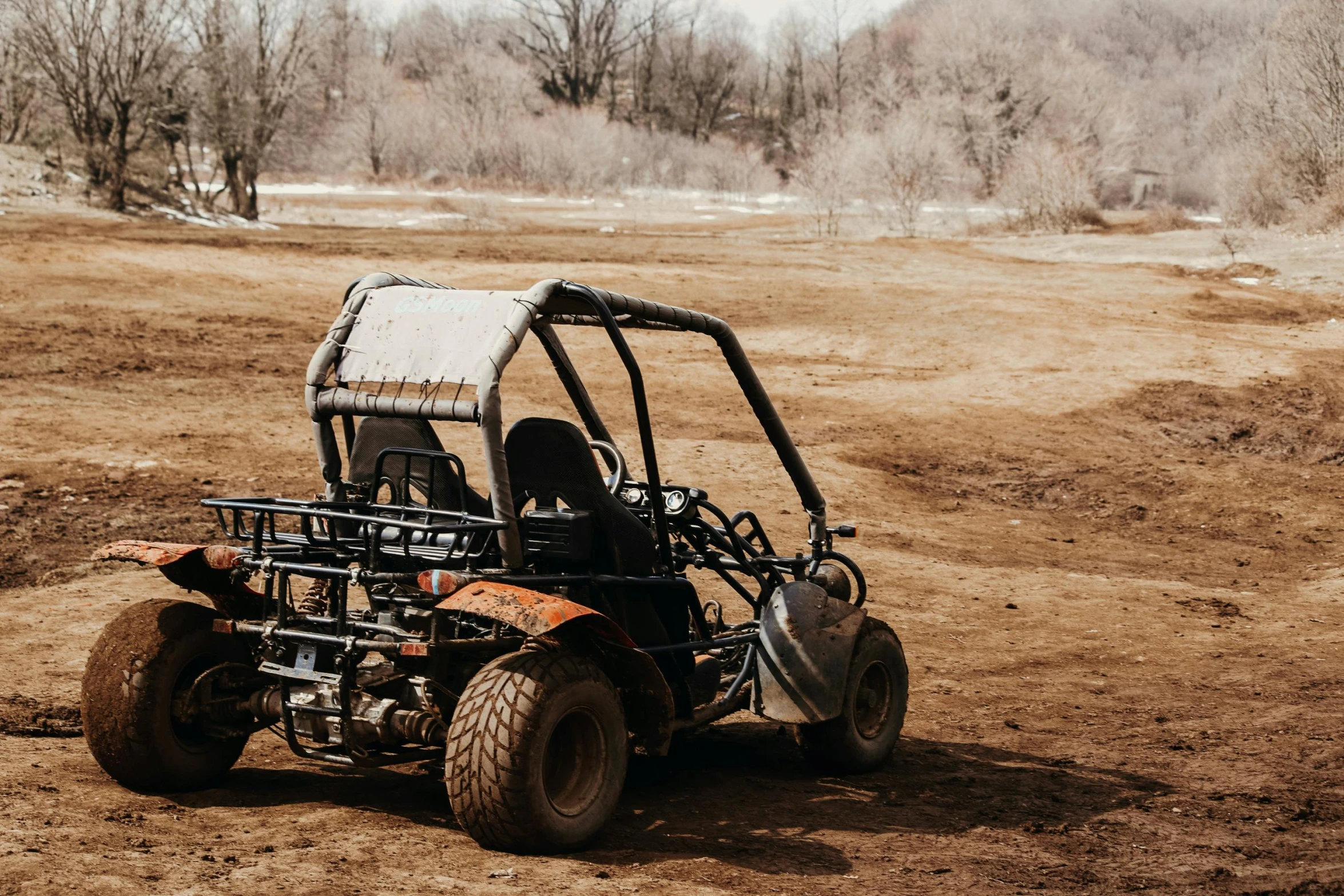 a small utilider that is parked in the dirt