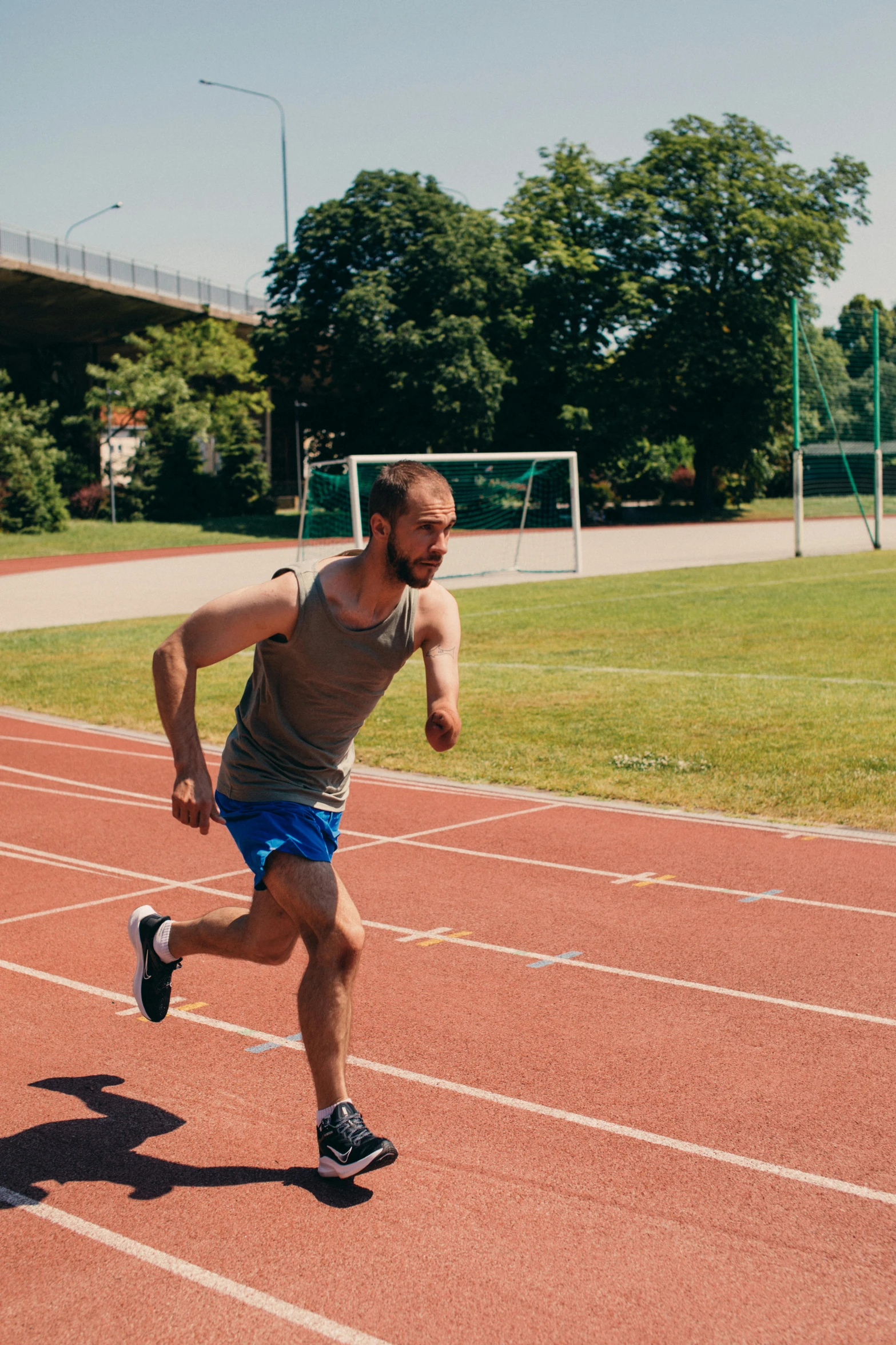 a man is running on a track outside