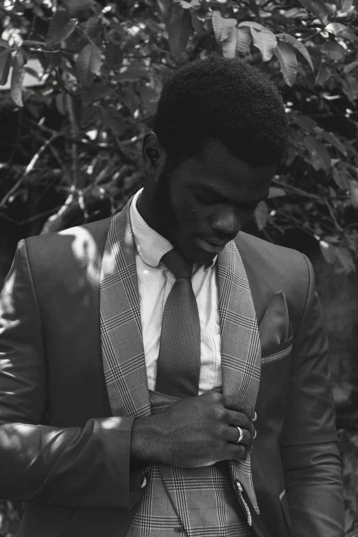 a black and white image of a man in a suit