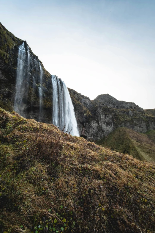 a view of a waterfall from the ground