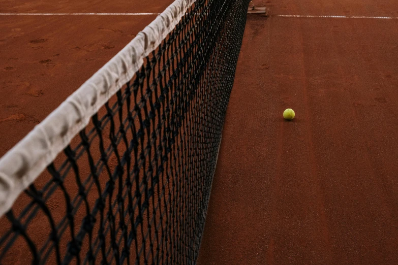 a closeup of tennis balls on the ground