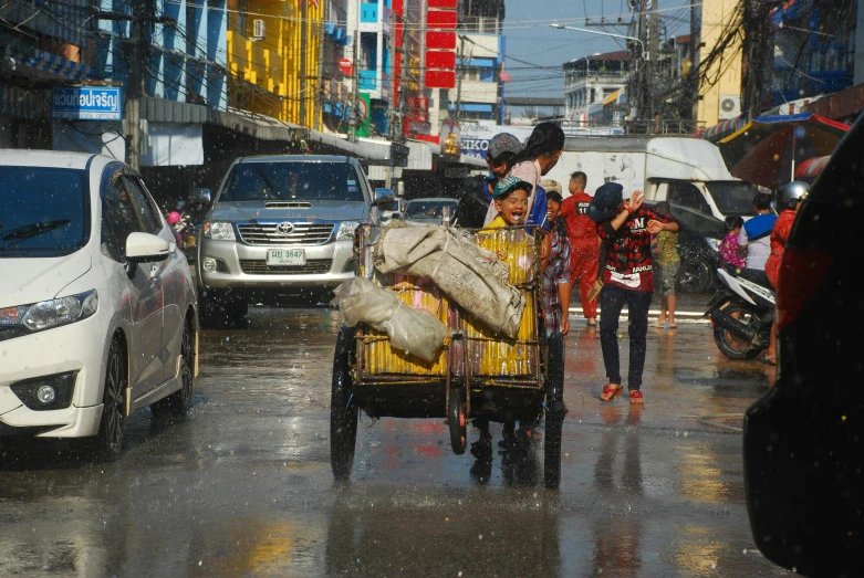 people walking on the street in the rain