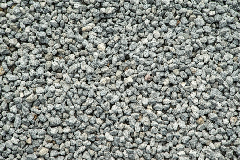 a gray rock is surrounded by small pebbles