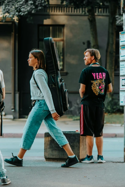 a group of people that are walking down the street