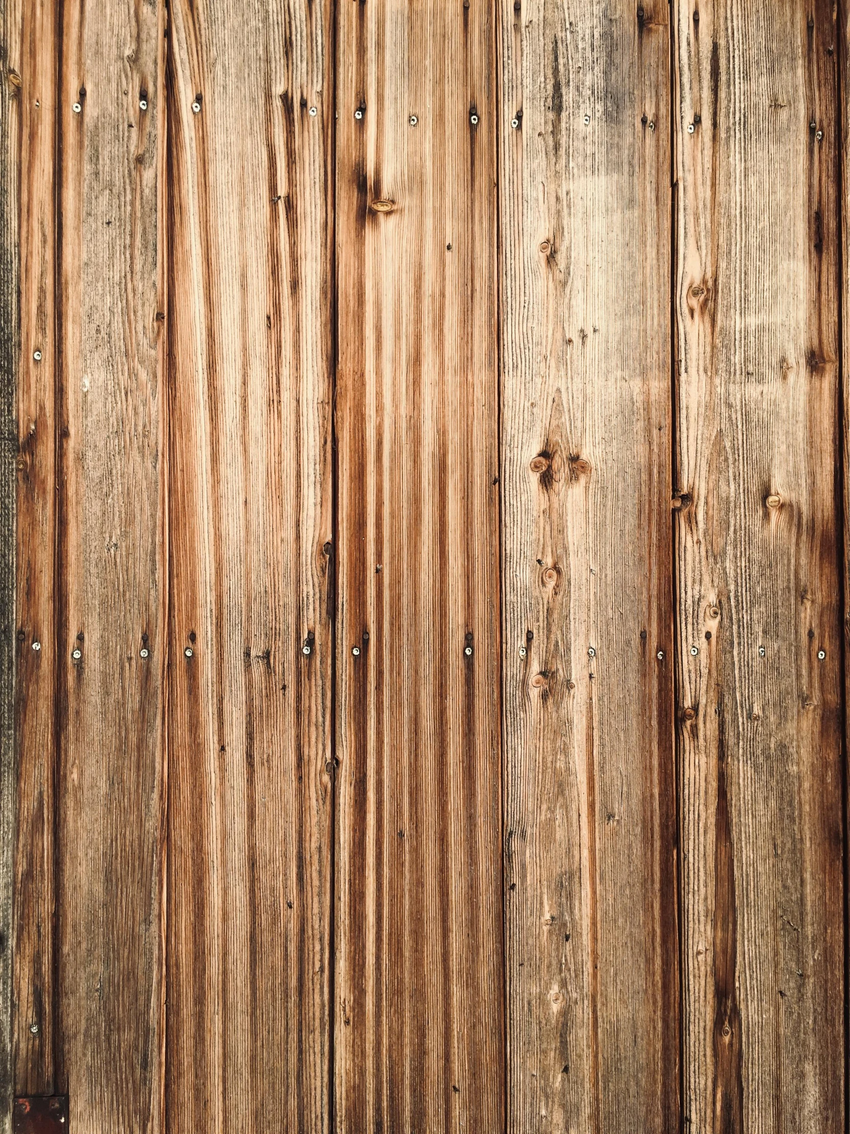 old wooden paneled wall with some chipped paint