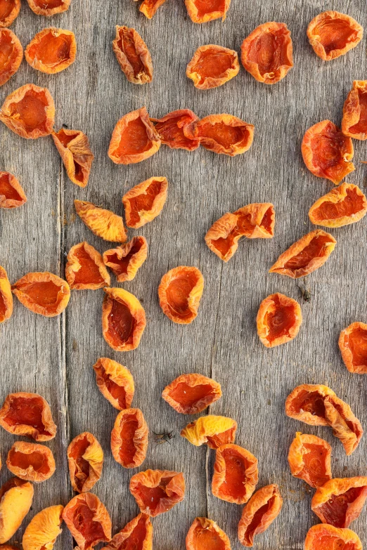 peeled oranges lay on the floor near each other