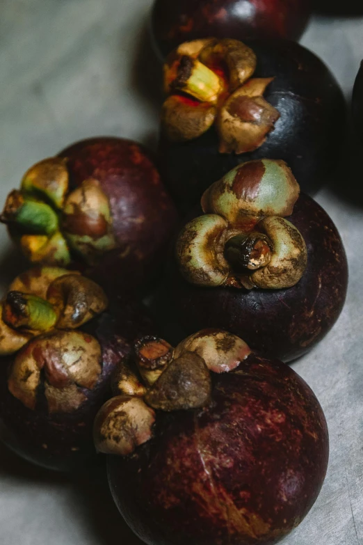 a number of plums sitting on the floor