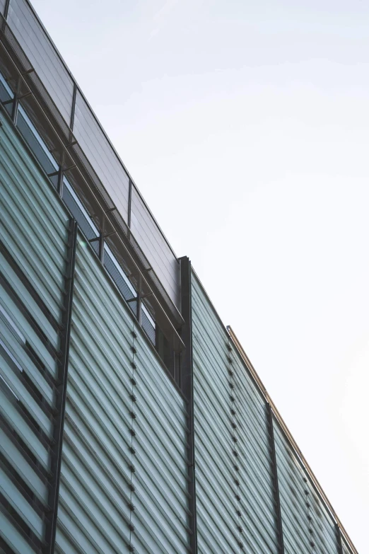 the side of a metal building with a light