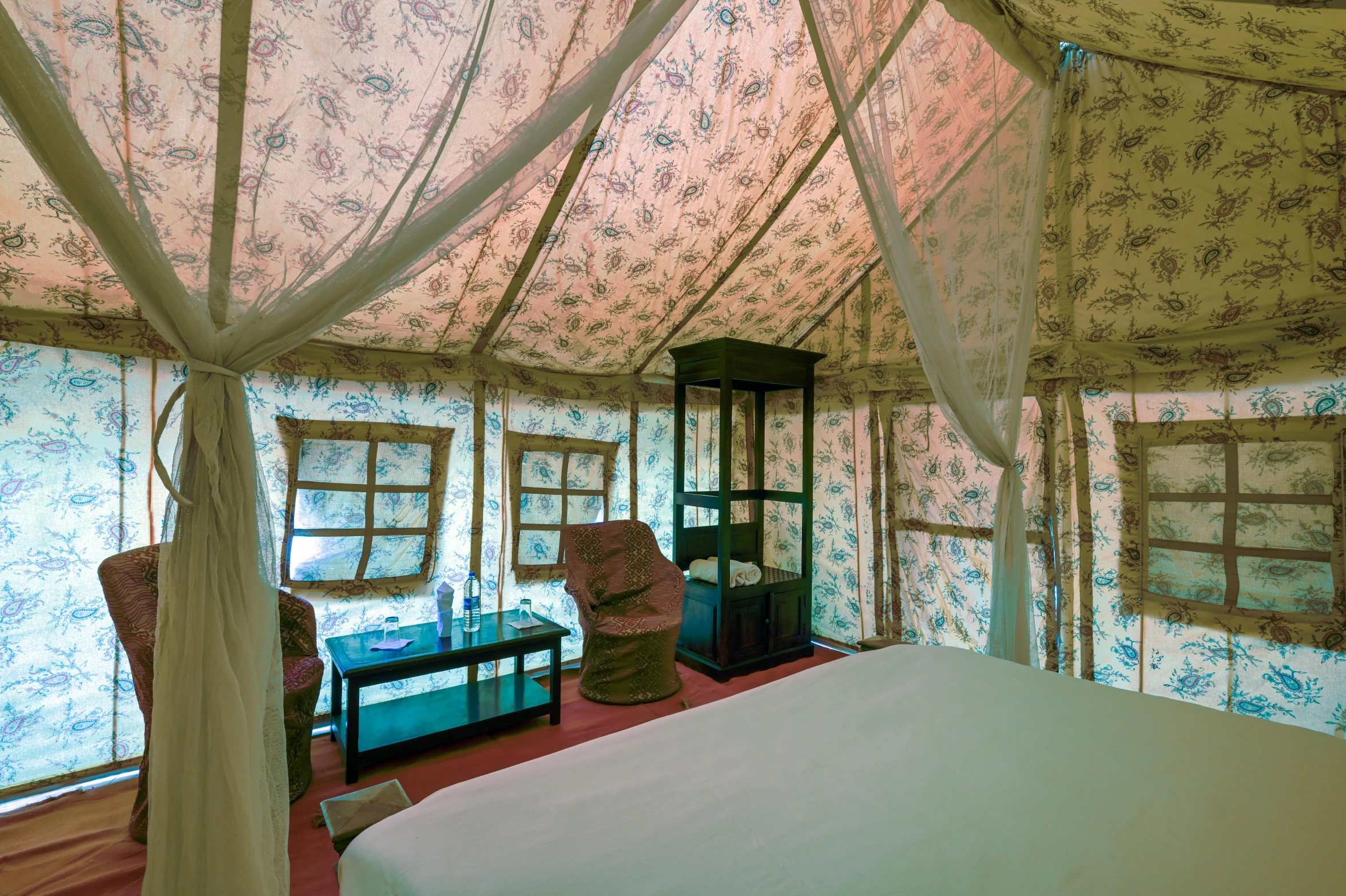 inside view of bed with floral fabric covering