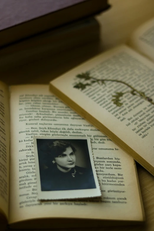 open book on table with a black and white po