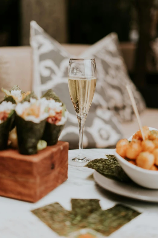 an appetizer setting with a drink in a glass