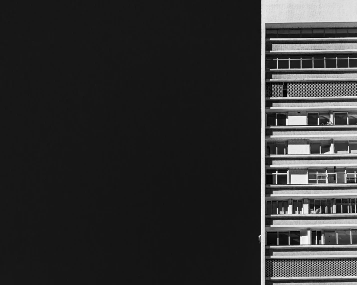 a black and white po of a building with a stop sign