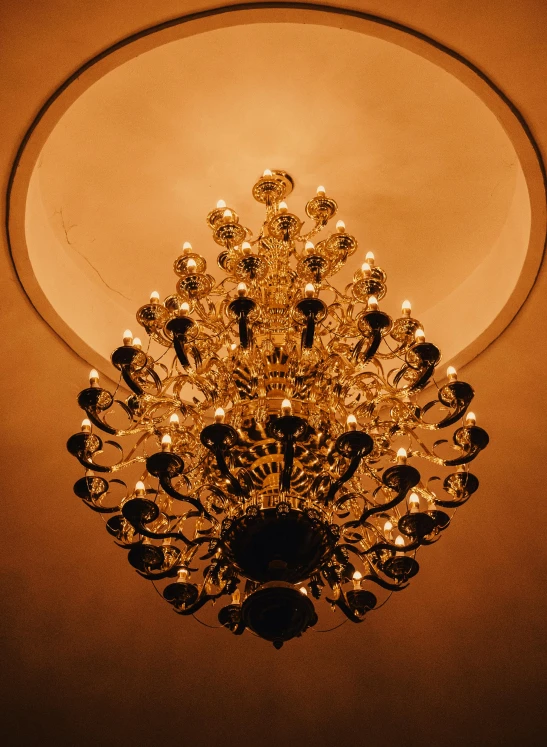 a fancy light fixture with dim lighting on the ceiling