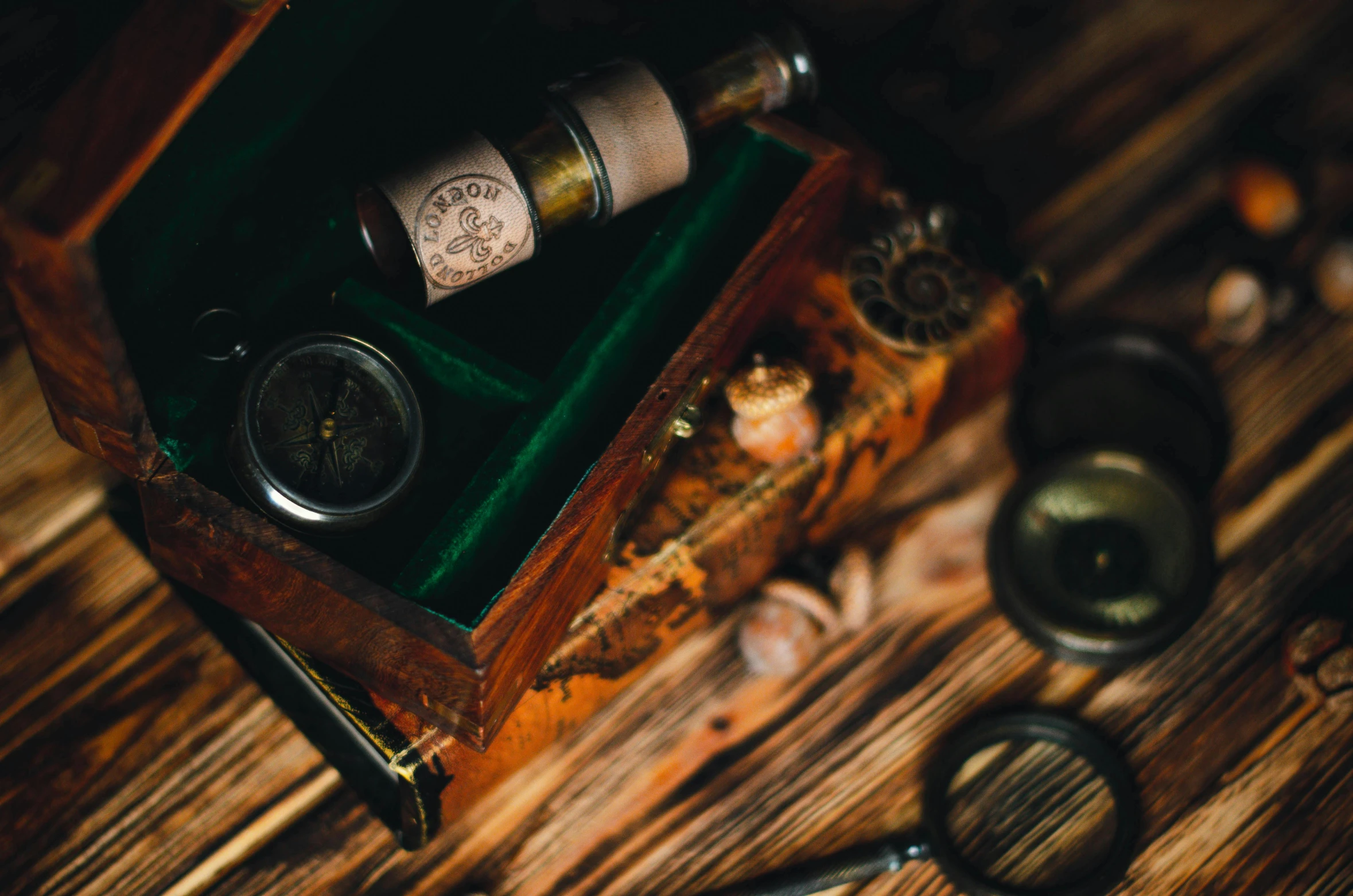 an old wooden box holding several different small items