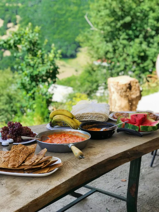 a table that has many different foods on it