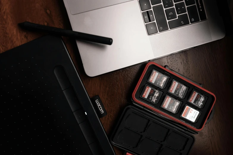 several storage sections in a laptop case next to a keyboard