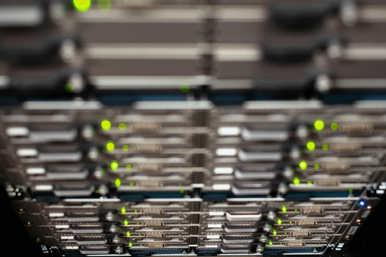 the top of a row of metal racks filled with lime green balls