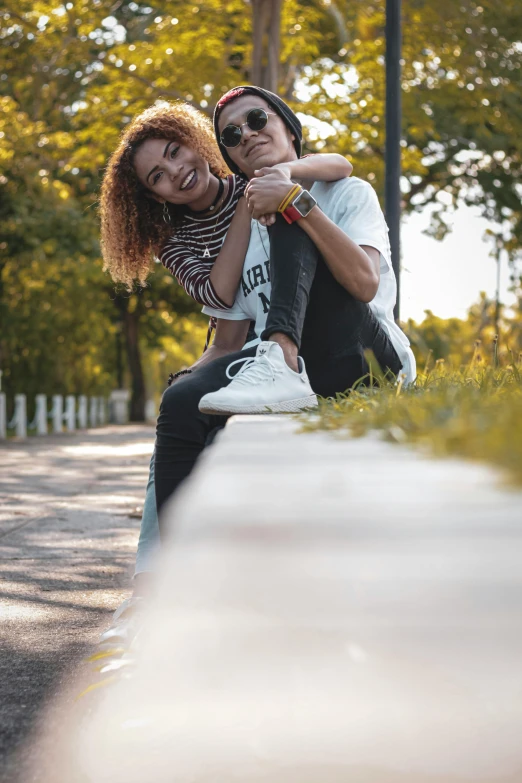 an attractive young lady sitting on top of a man