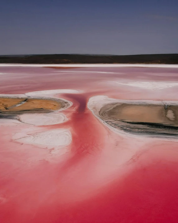 an aerial view of the water in the red - colored basin