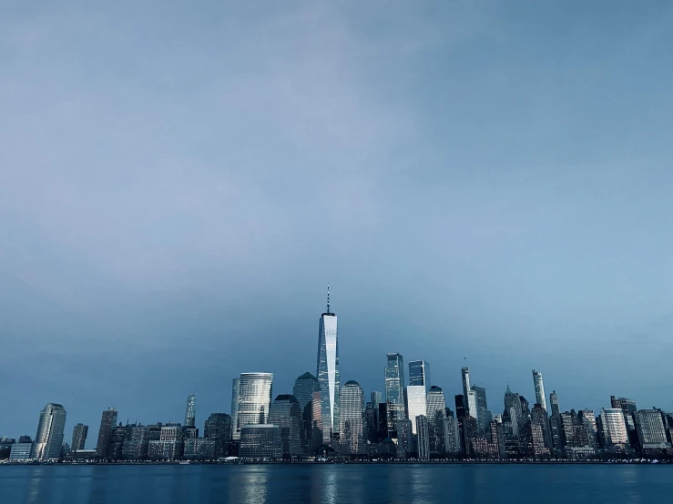 a view of new york city in the dark blue night