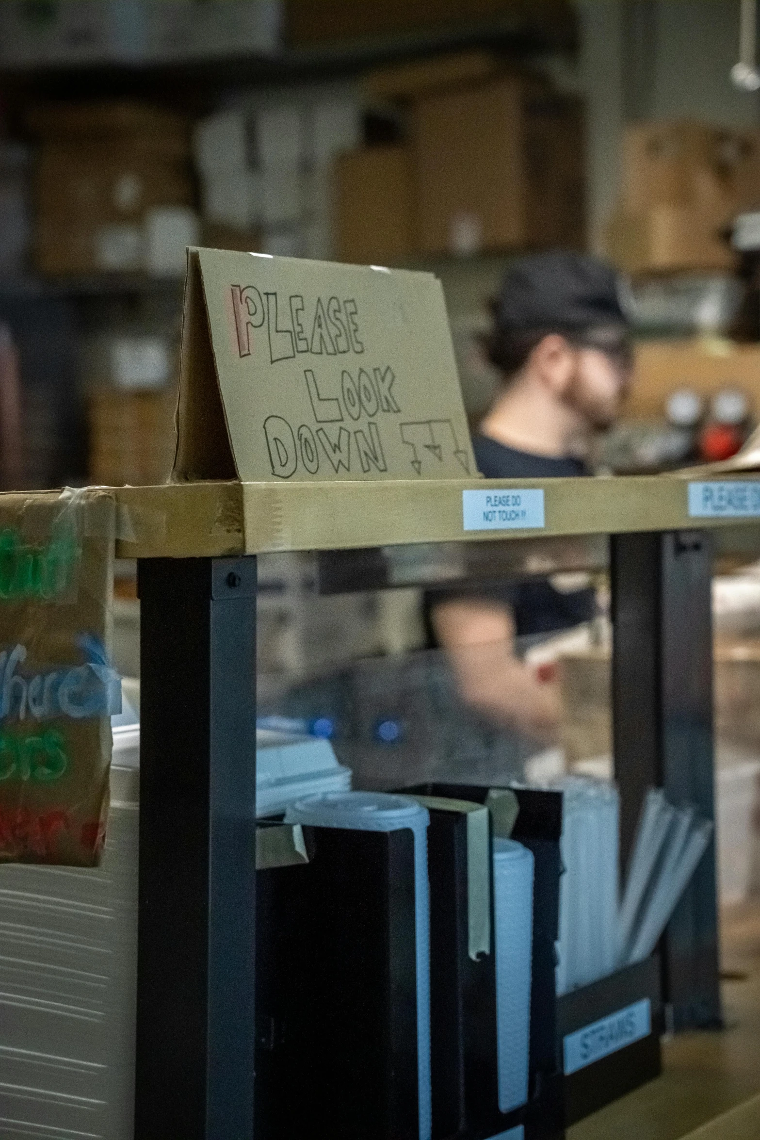 two people sitting at work while they have food