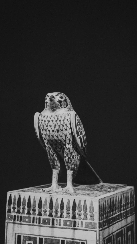 a statue of an owl with a leash on it