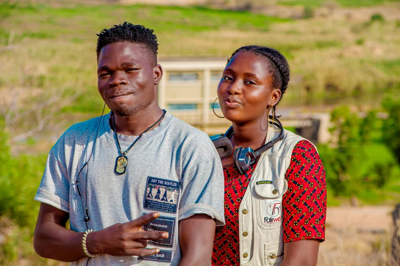 man and woman are posing for the camera