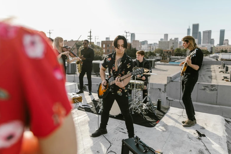 some musicians are on a rooftop together