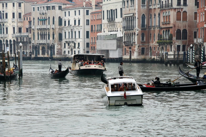 people on boats in the middle of the water