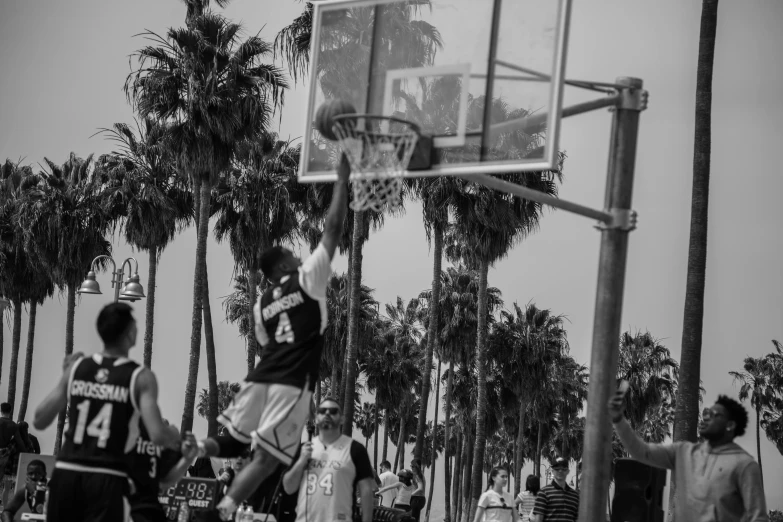 a man that is standing on a court with a basket