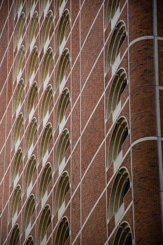 a brick building with curved windows on it