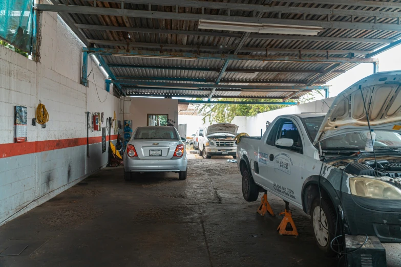 a car is parked inside of a car garage