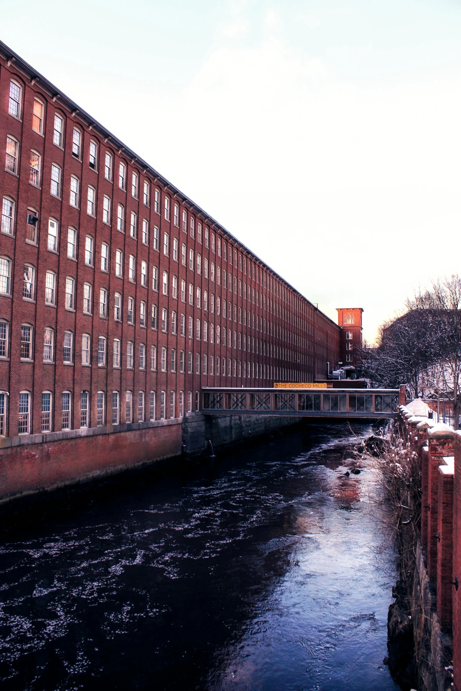 the canal runs between two old brick buildings