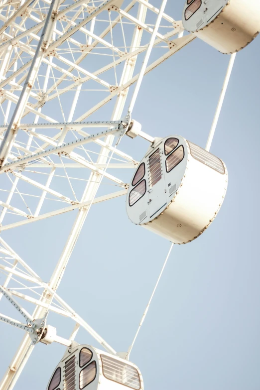 a ferris wheel that is being watched by several people
