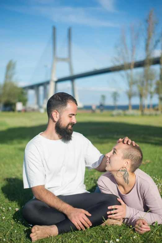 a man is smiling with his head up to the forehead of his son