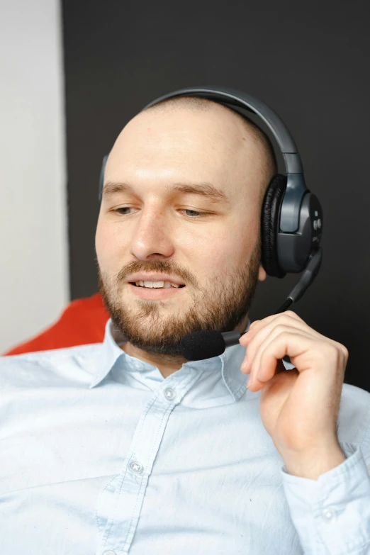 a man is listening to the music while wearing headphones