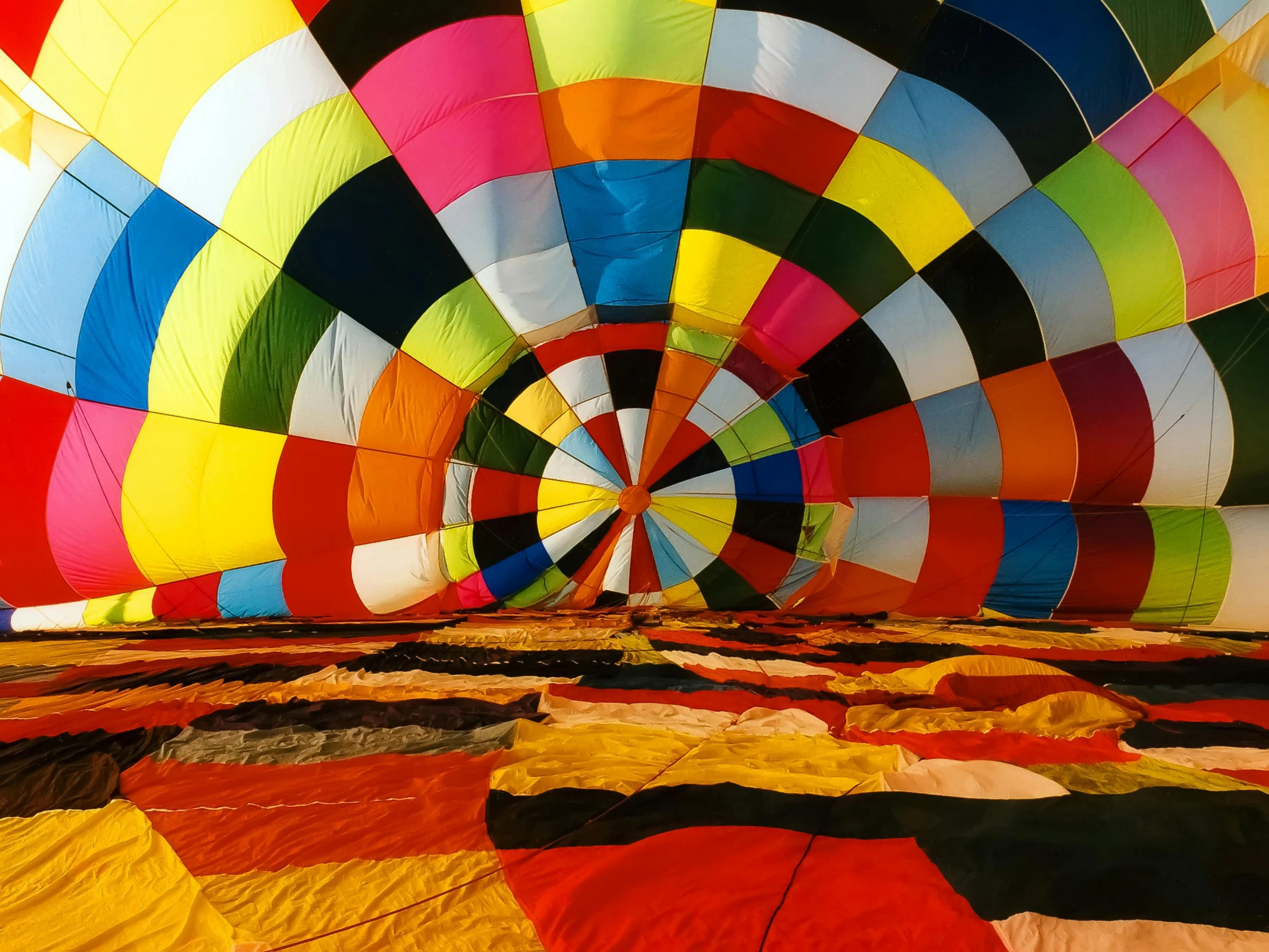 a large multicolored  air balloon in the sky