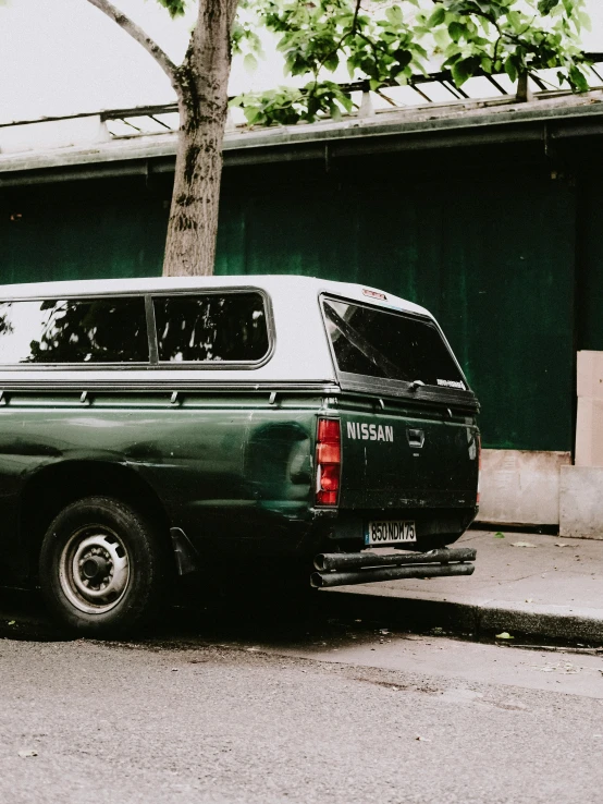 an old van parked on the side of the street