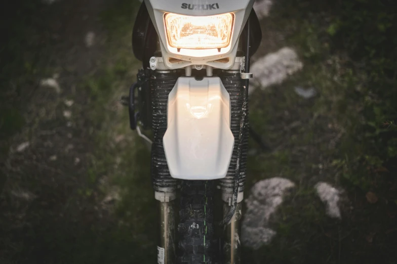 the headlight of a motorcycle with its lights on