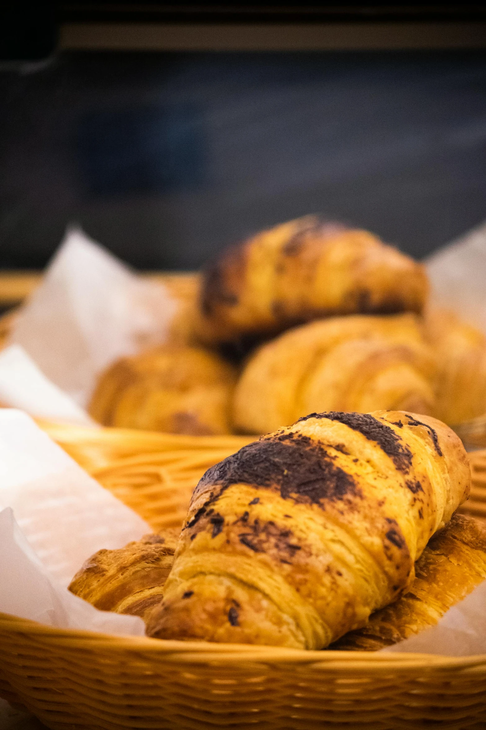 an assortment of baked goods sitting in a basket