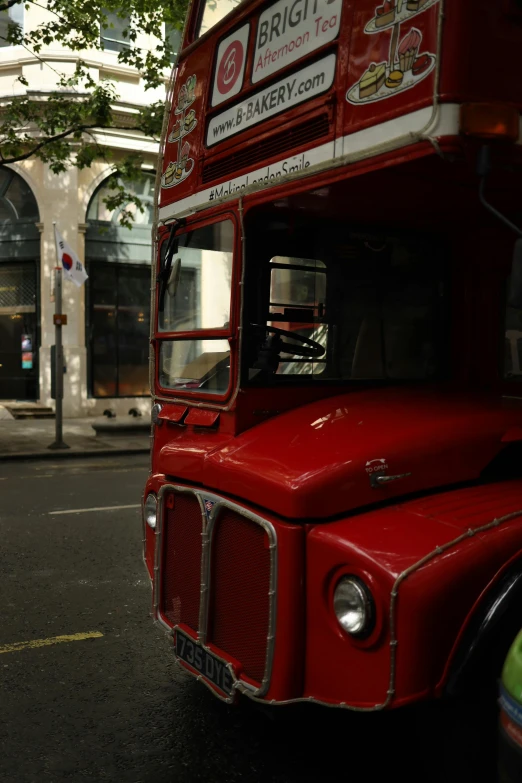 the truck is red and has white writing on it